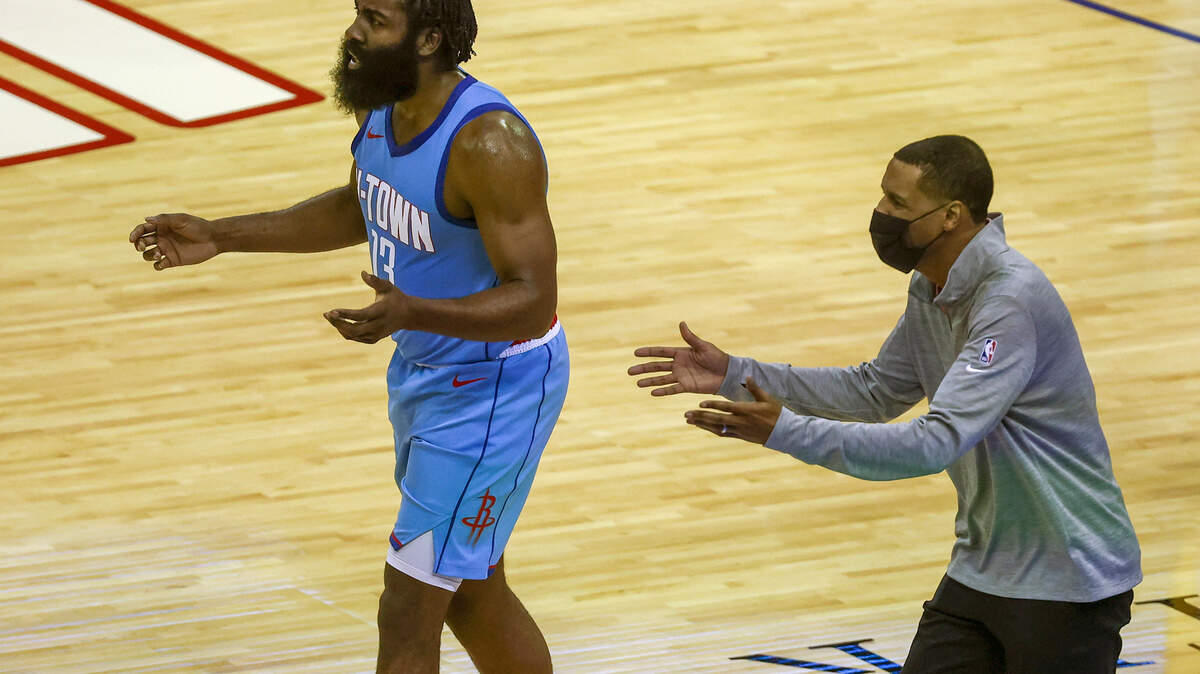 Houston Rockets guard James Harden (13) and coach Stephen Silas, right, react after a play during the second quarter against the Los Angeles Lakers in an NBA basketball game Tuesday, Jan. 21, 2021, in Houston. (Troy Taormina/Pool Photo via AP)