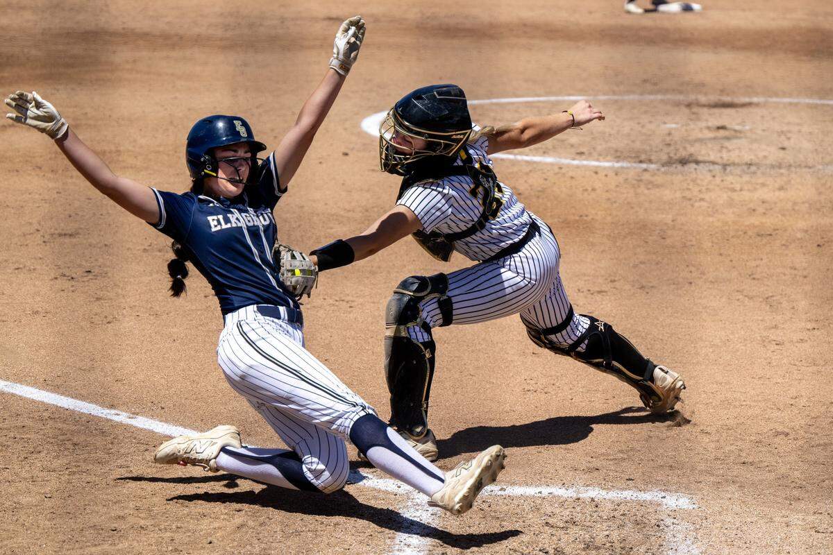 Del Oro Golden Eagles catcher Emma Johnson tags out an Elk Grove Thundering Herd baserunner to end the fourth inning Saturday in the CIF Sac-Joaquin Section Division II softball championship at Sacramento State.