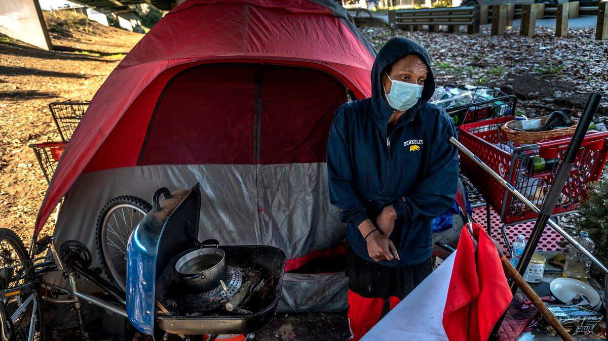 A homeless person living underneath a freeway interchange in Sacramento.
