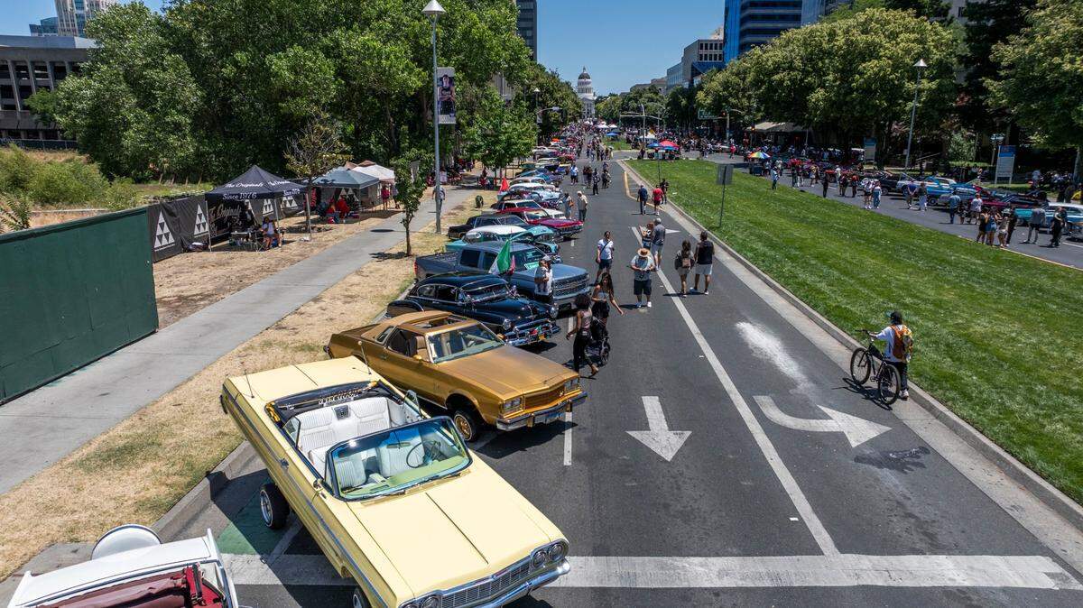 Classic cars line Capitol Mall during the California Lowrider Holiday Celebration on Sunday.