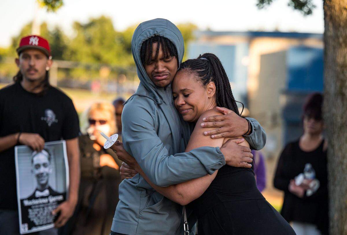 Mactavious Garren’s older brother, Damacio, embraces their aunt, Vanessa Fulcher, during a vigil in Elk Grove on July 6for the 19-year-old who was killed in a shooting on the Fourth of July in south Sacramento.