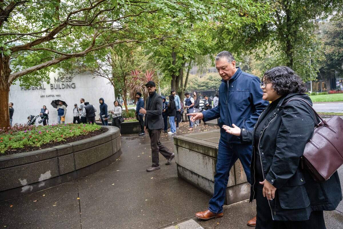 Sen. Alex Padilla speaks with NorCal Resist's Giselle Garcia as she arrives Thursday at the John E. Moss Federal Building in Sacramento, to tour the ICE Enforcement and Removal Operations Detention Center and monitor conditions inside. Afterward, Padilla said those arrested had “sadness on their faces because they don’t know what the next step will be.”