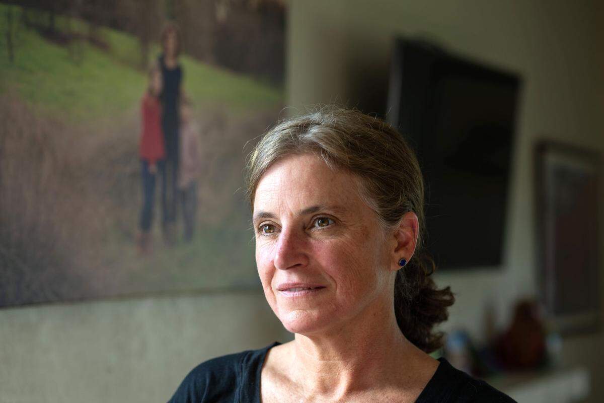 Beth Bourne, chapter president of Moms for Liberty Yolo County, at her Davis home in February. Bourne has been estranged from her child Lily Bourne after they came out as non-binary.