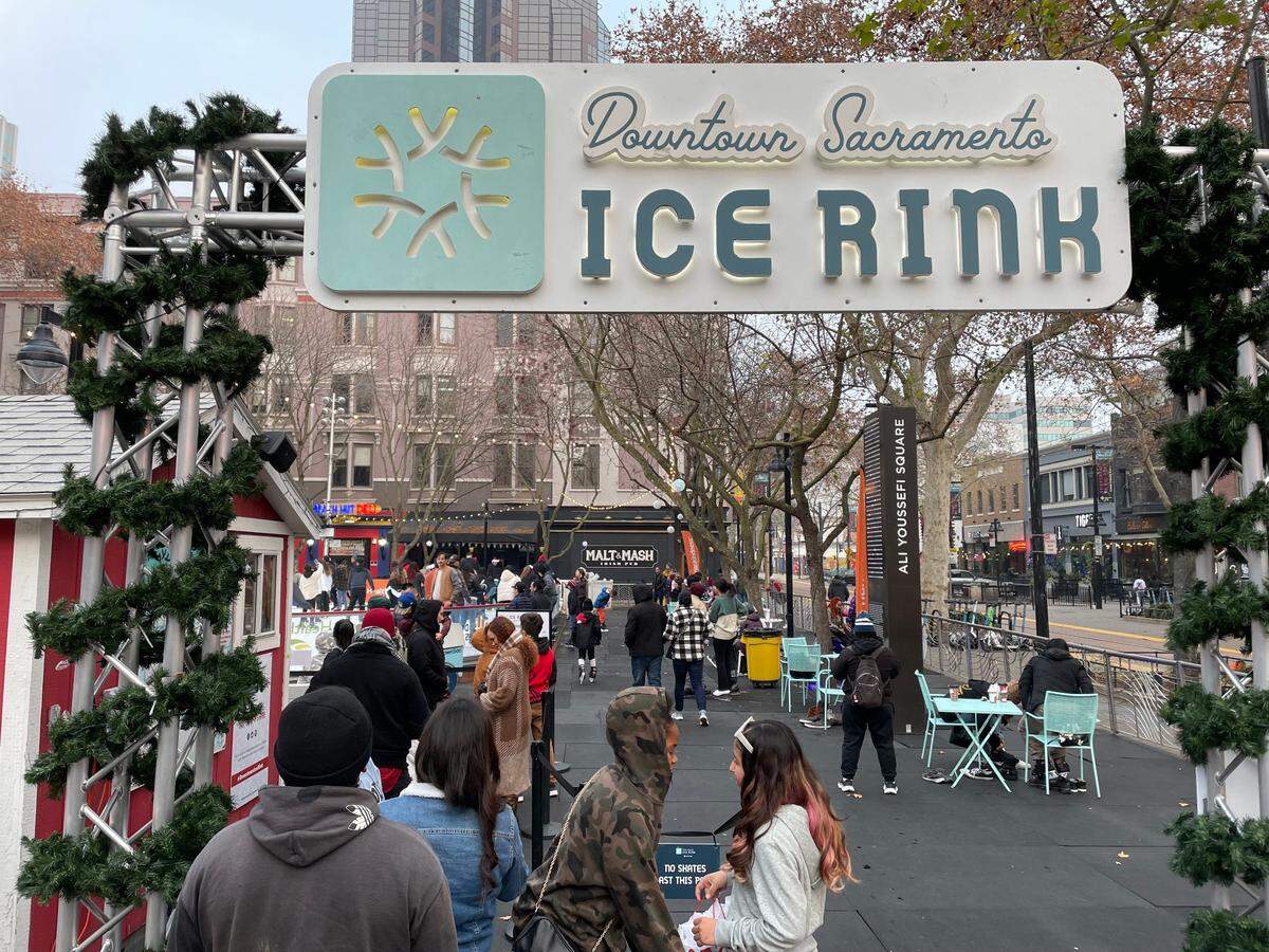 Service Journalism reporter Brianna Taylor visits Downtown Sacramento Ice Rink on Sunday, Dec. 18, 2022. The line to get into the family-friendly rink is wrapped around the entrance on a chilly winter afternoon.