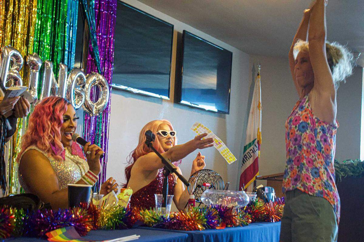 Amy Athey confirms the winning bingo card during drag queen bingo at the California State Fair on Saturday. The game is part of the fair’s Out at the Fair event at Sacramento’s Cal Expo.