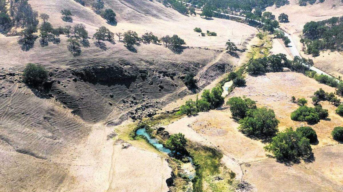 A stream winds through Colusa County near Maxwell Sites Road, the future location of the proposed Sites Reservoir dam. Construction costs for the project, now projected to exceed $6.2 billion, have surged due to inflation and material shortages. 