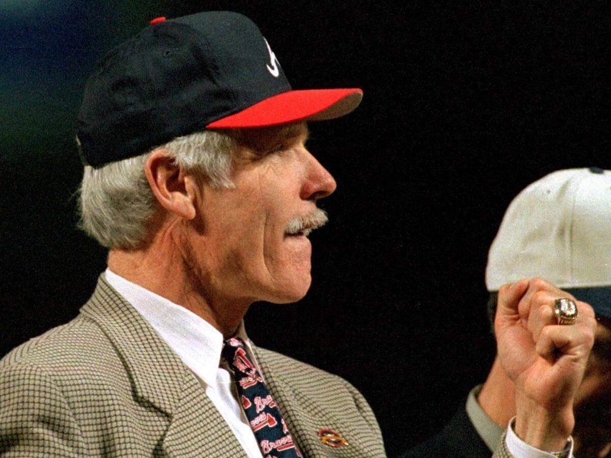 Ted Turner, owner of the Atlanta Braves, looks at his new National League ring, presented to him and the rest of the Atlanta Braves before the beginning of the first regular season game in the Braves new stadium, Turner Field, 04 April. The Braves beat the Chicago Cubs 3-4. AFP PHOTO Steven R. Schaefer (Photo credit should read STEVEN R. SCHAEFER/AFP via Getty Images)