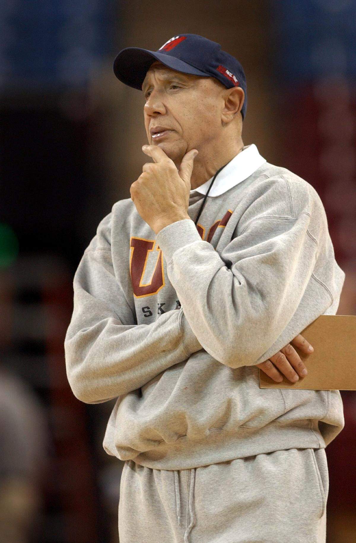 USC Trojans head coach Henry Bibby watches his team practice at Arco Arena in Sacramento on March 13, 2002. Henry Bibby is Mike Bibby’s father.