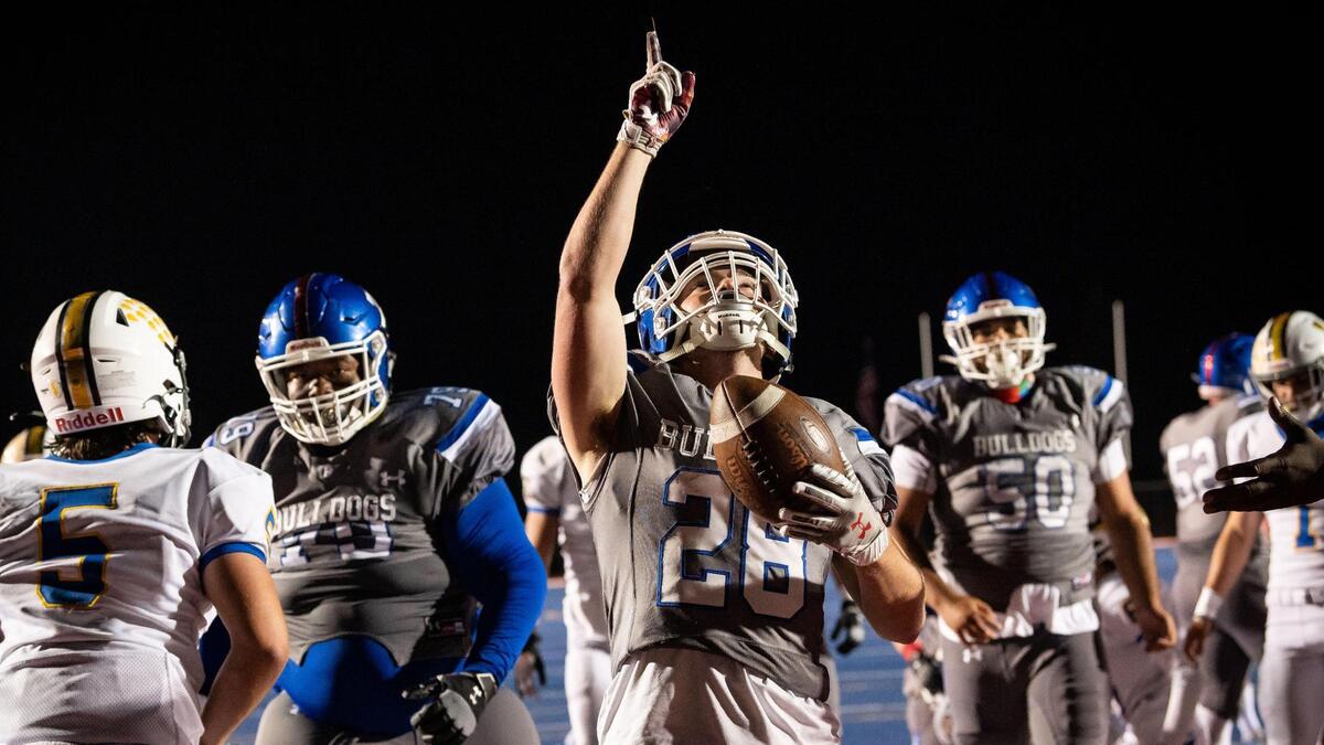 Folsom’s Mitch Anderson points skyward after running in a touchdown in the fourth quarter against Lincoln during the high school football game Friday, April 9, 2021, at Folsom High School in Folsom. Folsom beat Lincoln 41-14.