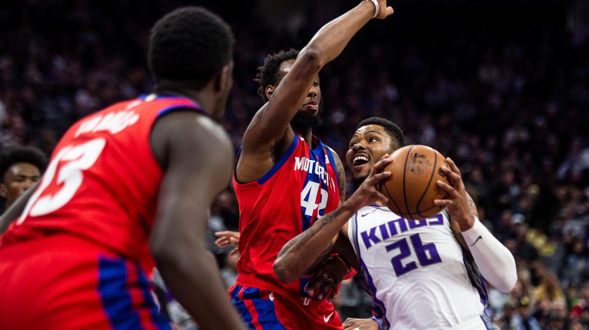 Sacramento Kings guard Kent Bazemore (26) is blocked while bringing the ball to the hoop during the first half during a game between the Sacramento Kings and the Detroit Pistons at Golden 1 Center in downtown Sacramento on Sunday, March 1, 2020.