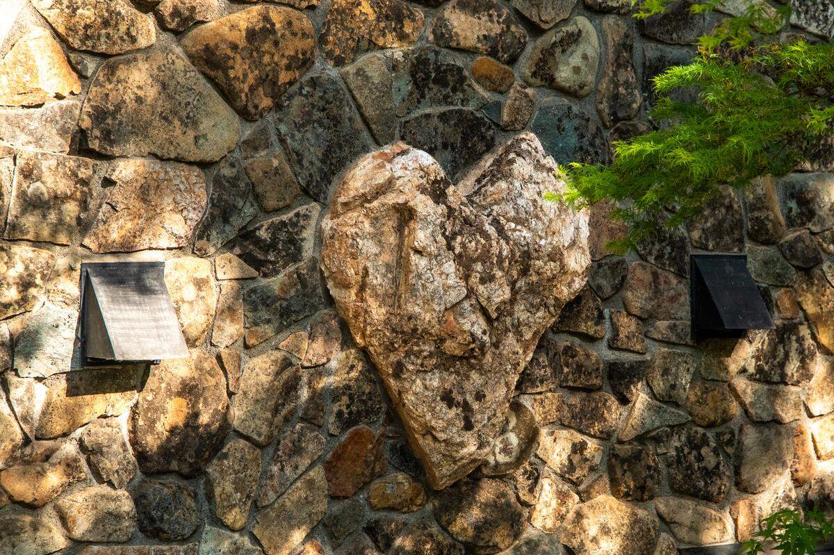 The property’s namesake heart rock, found in the 30-foot, handcrafted stone fireplace that is the centerpiece of the lodge.