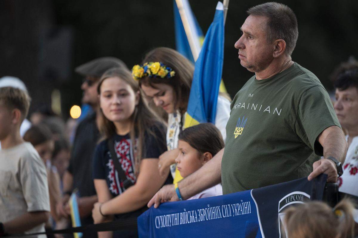 Ukrainian Americans react to a slideshow of recovering Ukrainian soldiers during a Ukrainian Independence Day celebration at the California Capitol in Sacramento on Sunday.