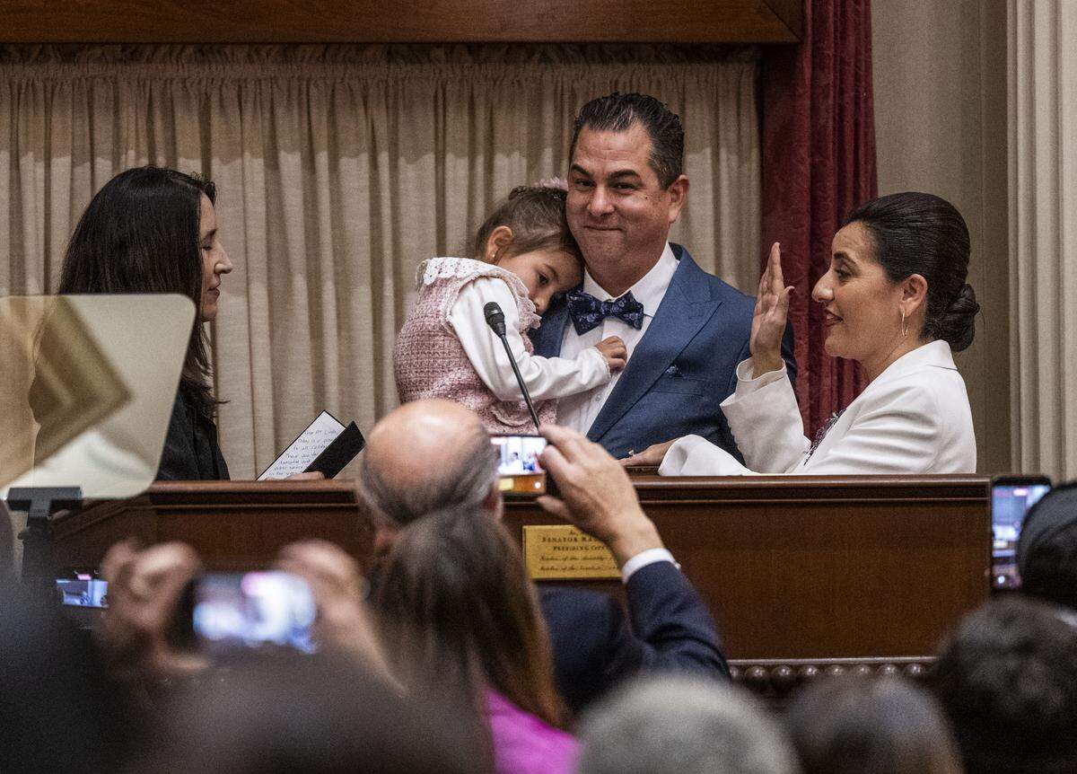 Senate President pro tem Monique Limón, D-Goleta, is sworn in by California Chief Justice Patricia Guerrero on Monday as her husband Michael Medel holds their five-year-old daughter Gianna.