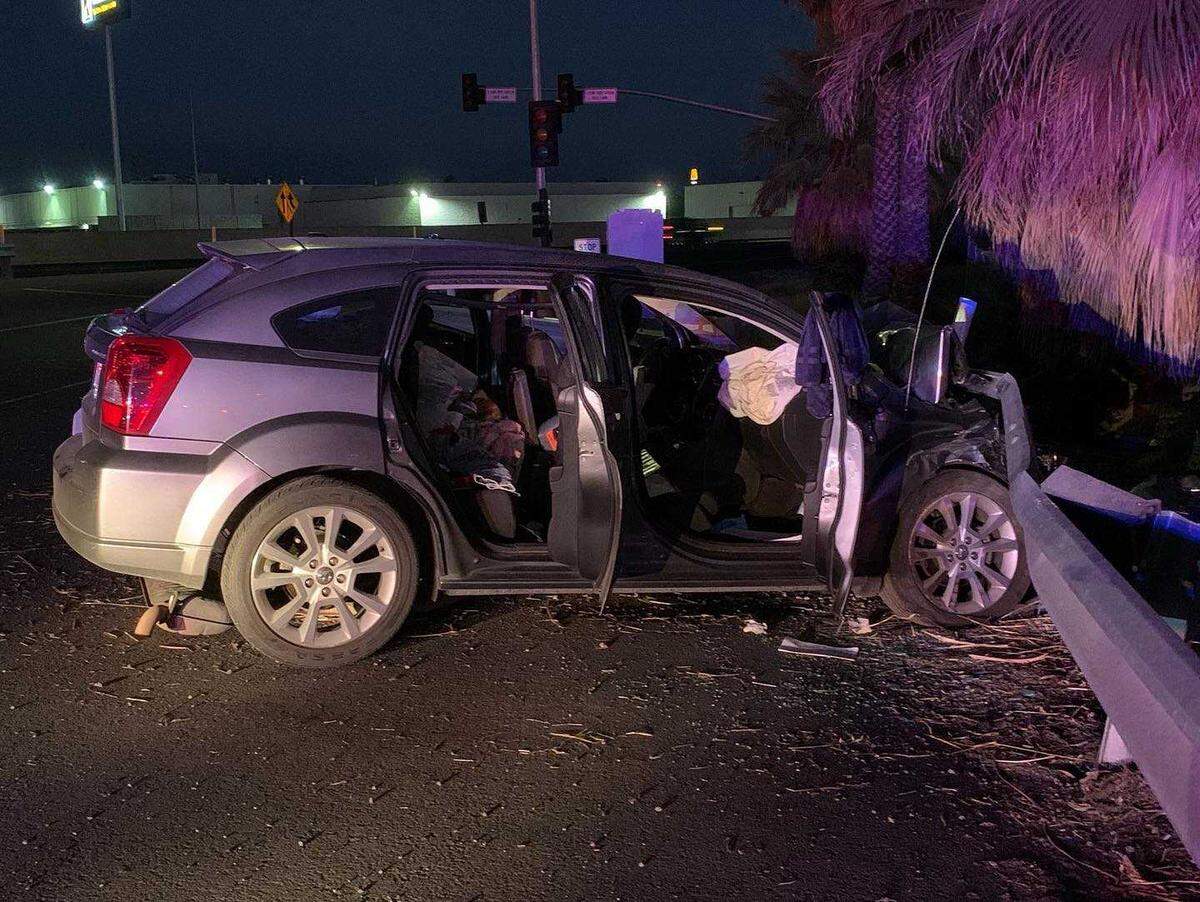 A Dodge Caliber is entangled with guardrail after a high-speed pursuit from Sacramento to Stockton in 2020. The California Highway Patrol said the two people in the vehicle were not injured and were arrested following the 30-minute chase.