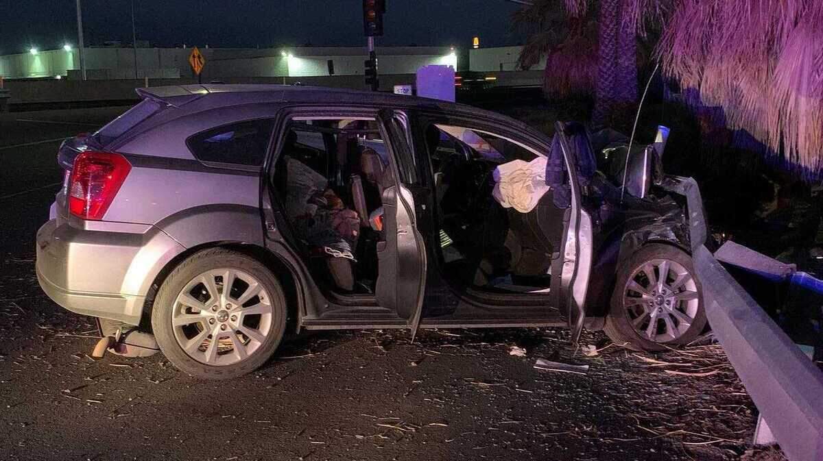 A Dodge Caliber is seen Thursday, Aug. 27, 2020, after crashing following a high-speed pursuit from Sacramento to Stockton, Calif. The California Highway Patrol said the two people in the vehicle were not injured and were arrested following the 30-minute chase.