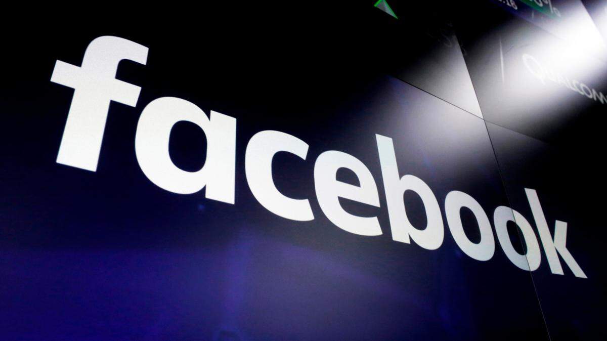 FILE - This March 29, 2018 file photo, shows the logo for social media giant Facebook at the Nasdaq MarketSite in New York’s Times Square. With just two months left until the U.S. presidential election, Facebook says it is taking additional steps to encourage voting, minimize misinformation and reduce the likelihood of post-election “civil unrest.” The company said Thursday, Sept. 3, 2020, it will restrict new political ads in the week before the election and remove posts that convey misinformation about COVID-19 and voting. (AP Photo/Richard Drew, File)