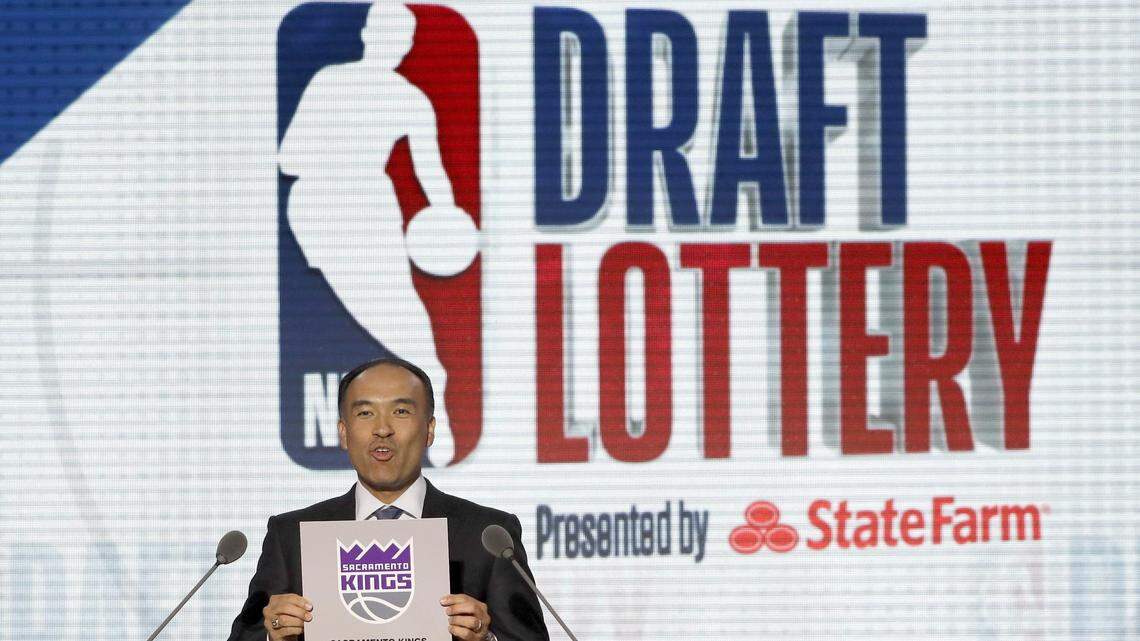 NBA Deputy Commissioner Mark Tatum announces that the Sacramento Kings had won the second pick during the NBA basketball draft lottery Tuesday, May 15, 2018, in Chicago. (AP Photo/Charles Rex Arbogast)