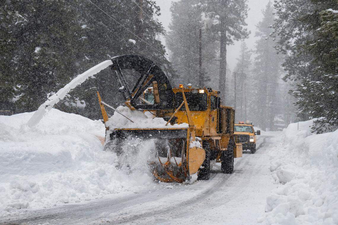 An El Dorado County snowplow clears a residential street in Tahoma on Jan. 5.