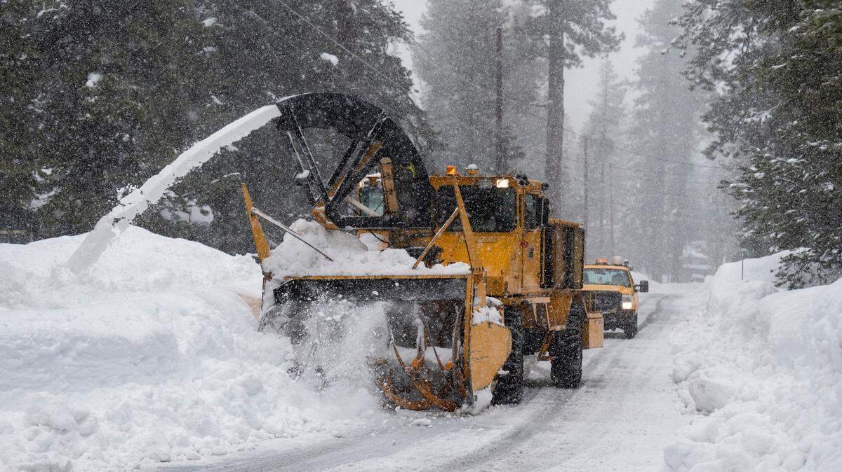 An El Dorado County snowplow clears a residential street in Tahoma on Thursday, Jan. 5, 2023. Heavy snow was falling across the Tahoe region.