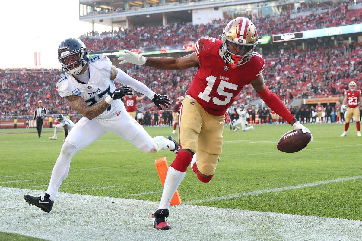  Jauan Jennings, No. 15, scores a touchdown against Amani Hooker of the Tennessee Titans during the third quarter at Levi's Stadium on December 14, 2025 in Santa Clara.