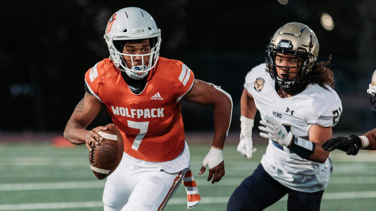 Cosumnes Oaks senior quarterback Anthony Grigsby eludes a defender.