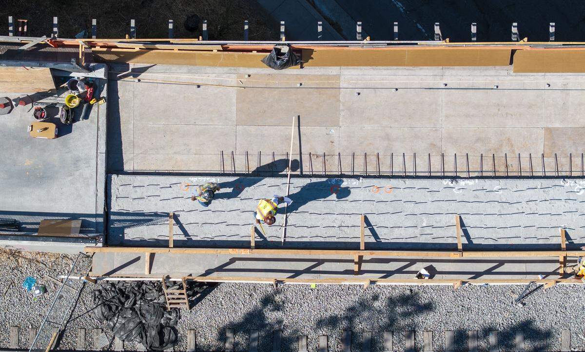 Workers reconstruct the Del Rio Trail Bridge on Thursday after a news conference where Sacramento Mayor Kevin McCarty said the project will be complete this fall at no additional cost to taxpayers.  