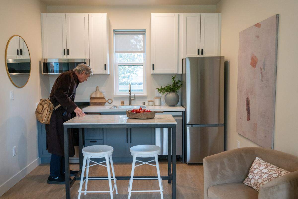 Sacramento civil rights attorney Mark Merin shows off a kitchen earlier this month at the new affordable housing apartment complex he developed in Sacramento. “We used European appliances, so they are small, but they are efficient and beautiful,” he said. A new law requires landlords include a refrigerator and stove in their units. 