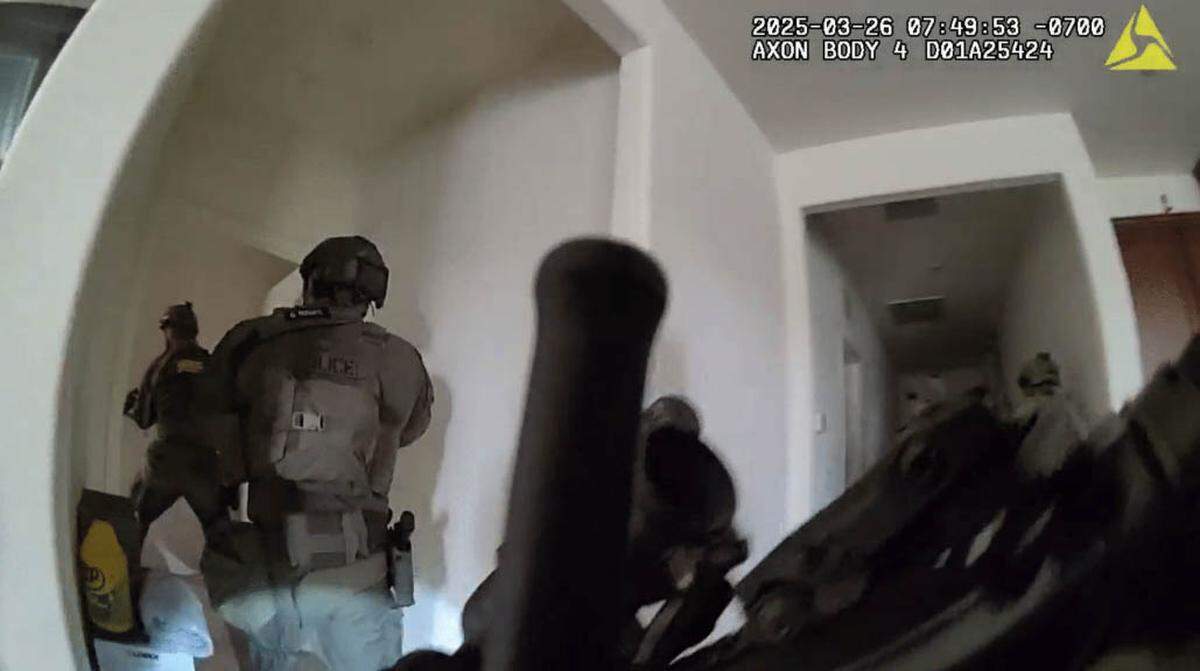 An image from video recorded by Yuba City Police Officer Juan Zavala’s body worn camera shows Yuba County Sheriff’s Office Sgt. Daniel Trumm, far left, followed by Marysville Police Officer Osmar Rodarte, entering the master bedroom where they found Rick David Oliver on March 26, 2025, and a fatal exchange of gunfire ensued. Rodarte and Oliver were killed.