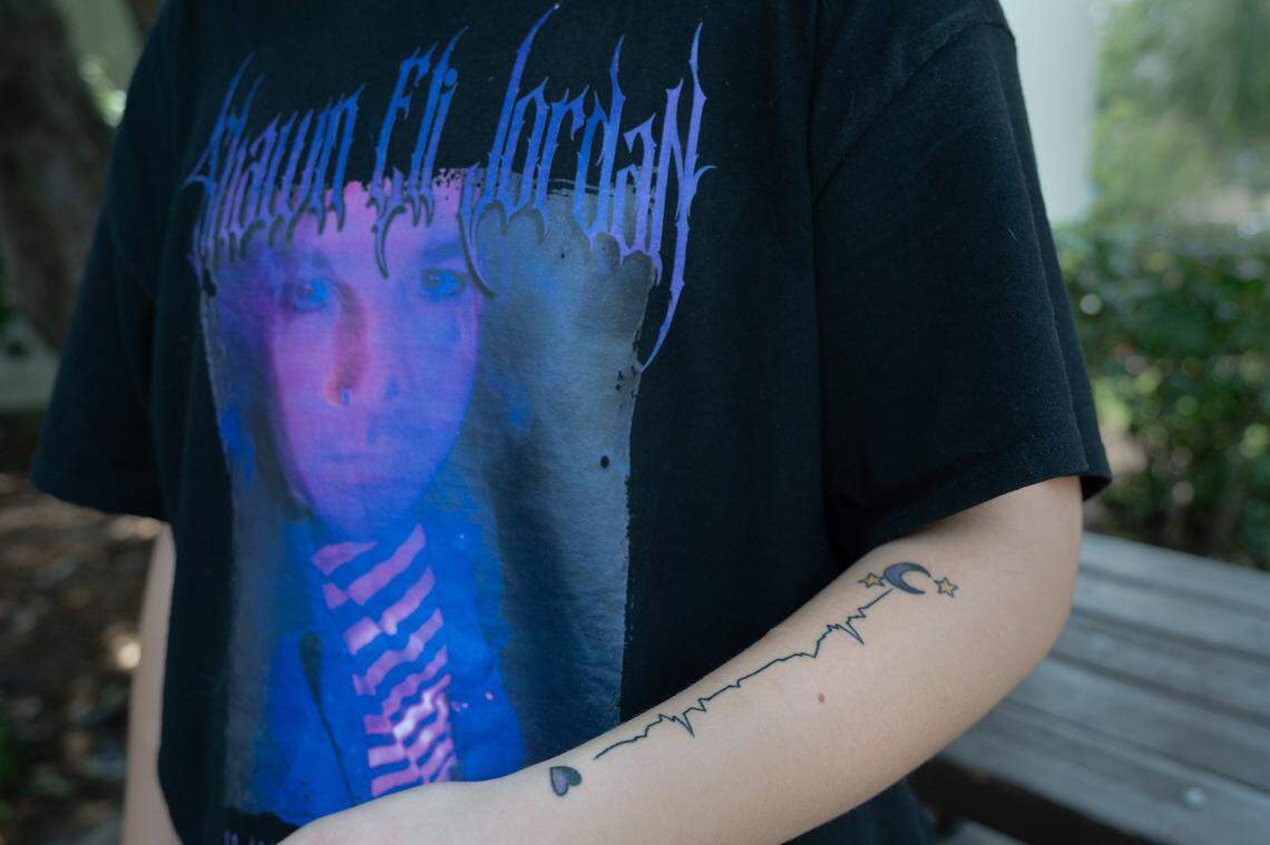 Sal Eldridge, 17, wears a T-shirt with his boyfriend Shawn Jordan’s picture in his favorite color purple at a celebration of life memorial for Shawn at Rusch Community Center in Citrus Heights on July 28. Eldridge said he had recently gotten a tattoo of Shawn’s last heartbeats on his arm.