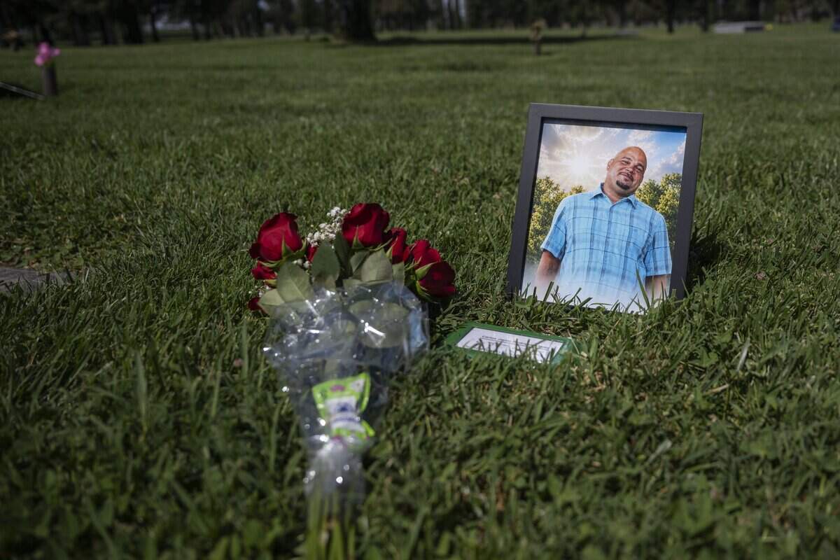 A photo of Carlos Rodriguez-Mora, one of the victims of the Esparto fireworks explosion, is displayed on Monday, June 15, 2026, where his wife Tiffany Nolan-Rodriguez had his ashes buried at Lakewood Memorial Park in Hughson.