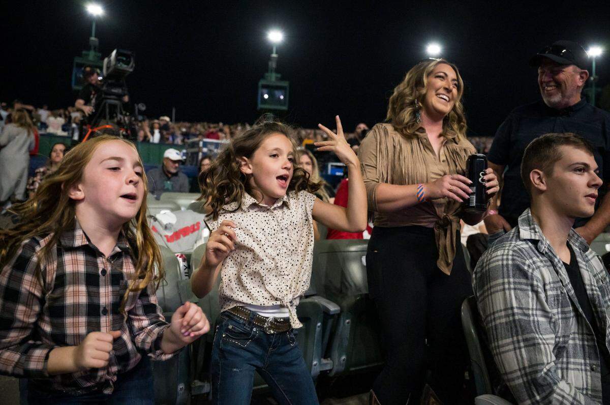 Sisters Hayden, 8, left, and Hadley, 9, of Marysville, dance along to “Hollaback Girl” by Gwen Stefani as the D.J. plays music before Jason Aldean takes the stage at his Highway Desperado tour concert Thursday, Sept. 21, 2023, at Toyota Amphitheatre in Yuba County.