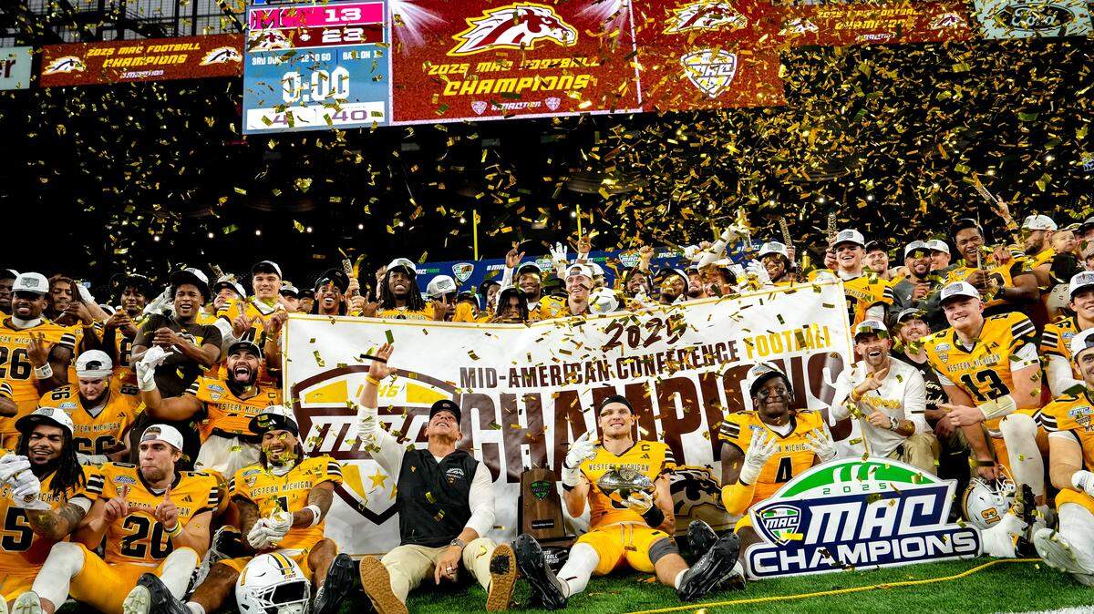 The Western Michigan Broncos celebrate winning the 2025 MAC Football Championship against the Miami (Ohio) RedHawks at Ford Field on Dec. 6 in Detroit.