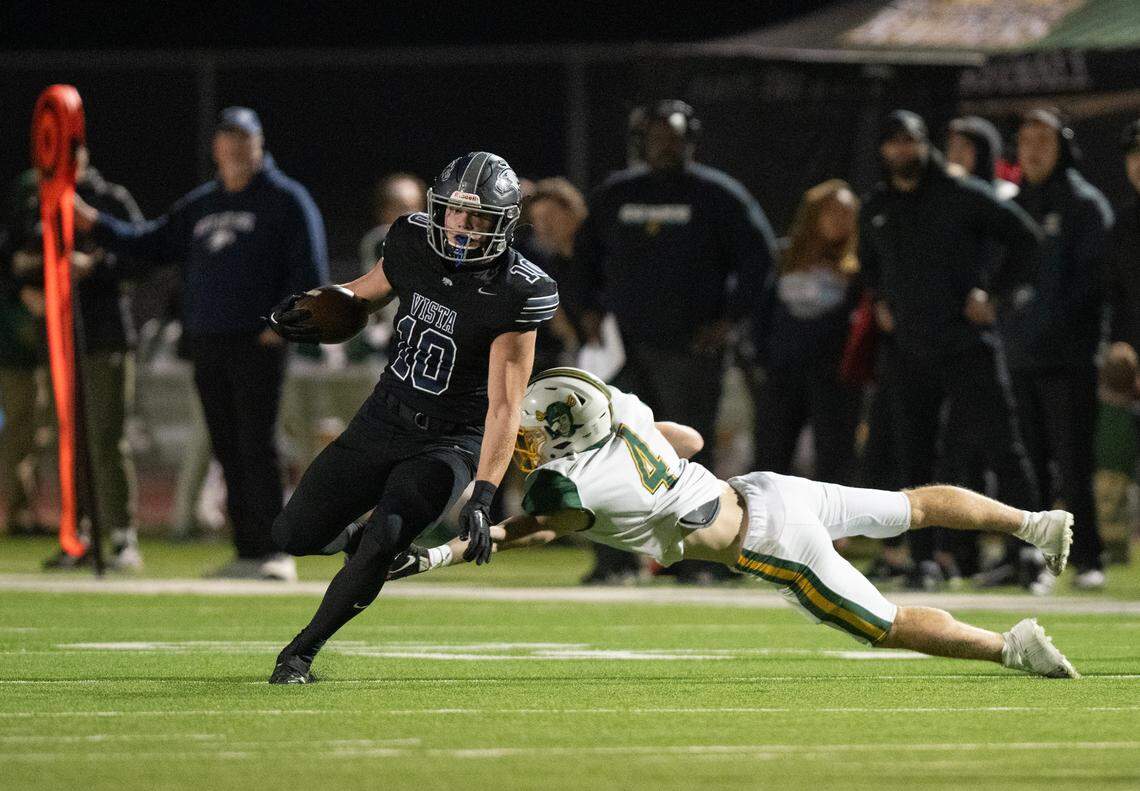 Vista del Lago Eagles receiver Matt Long (10) evades the Rio Americano Raiders’ Chase Carry (4) on his way to a 61-yard touchdown in the CIF Sac-Joaquin Section Divison IV playoff quarterfinal in November.