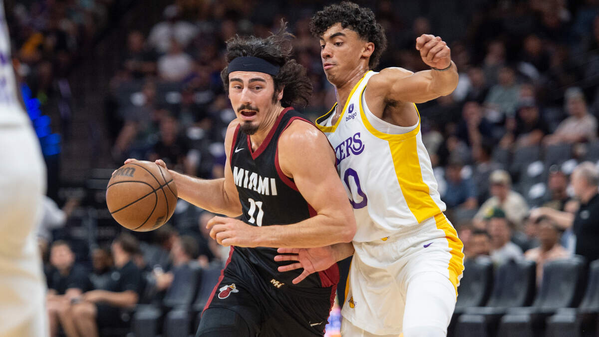 Miami Heat Jaime Jaquez Jr. (11) drives to the basket with Los Angeles Lakers Max Christie (10) defending in the first half of the California Classic Monday, July 3, 2023, at Golden 1 Center.