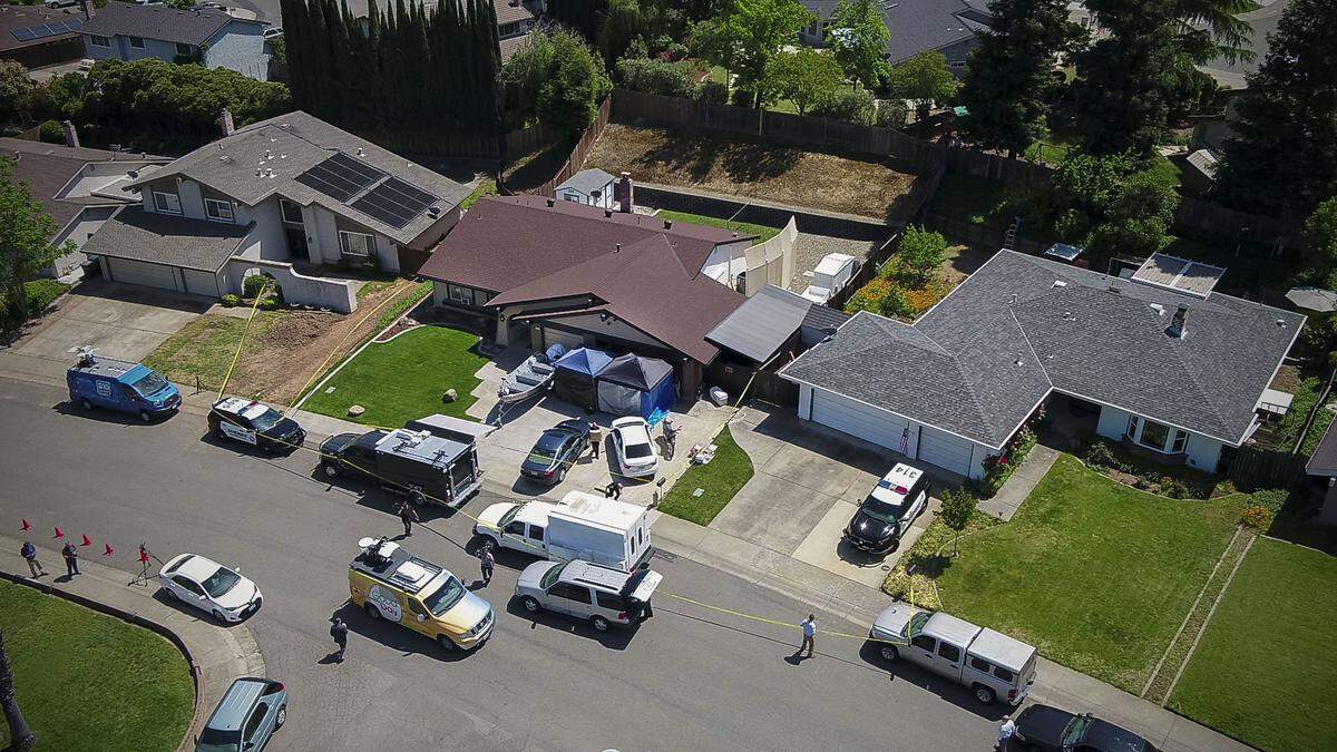 Law enforcement authorities process evidence at the home of suspected East Area Rapist at his home, center, in Citrus Heights in April 2018.