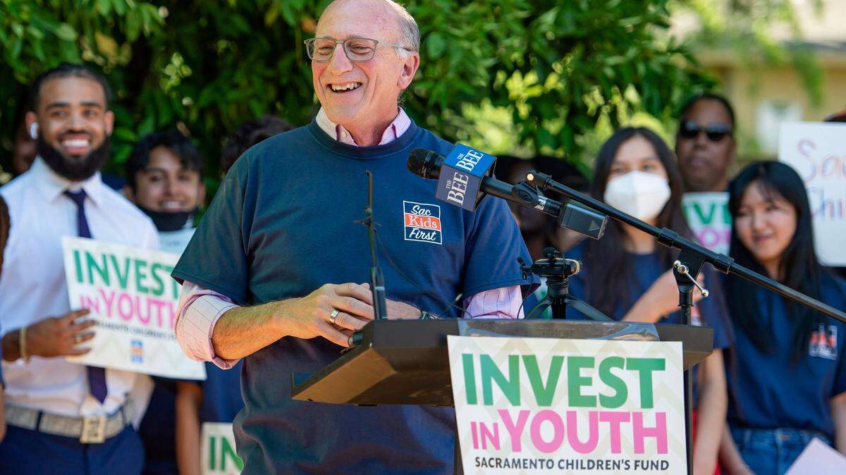 Councilmember Jay Schenirer laughs after telling a joke at the press conference for Sac Kids First on Monday, June 13, 2022, at Mack Road Valley Hi Community Center in Sacramento. City leaders announced a new initiative to establish a childrens fund for the City of Sacramento through a measure to be placed on the November 2022 ballot.