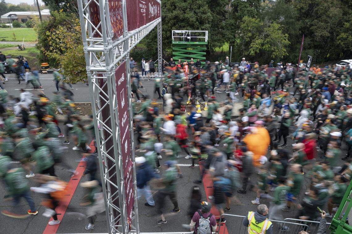 Runners in the 5k race start running during the Run to Feed the Hungry in Sacramento on Thursday.