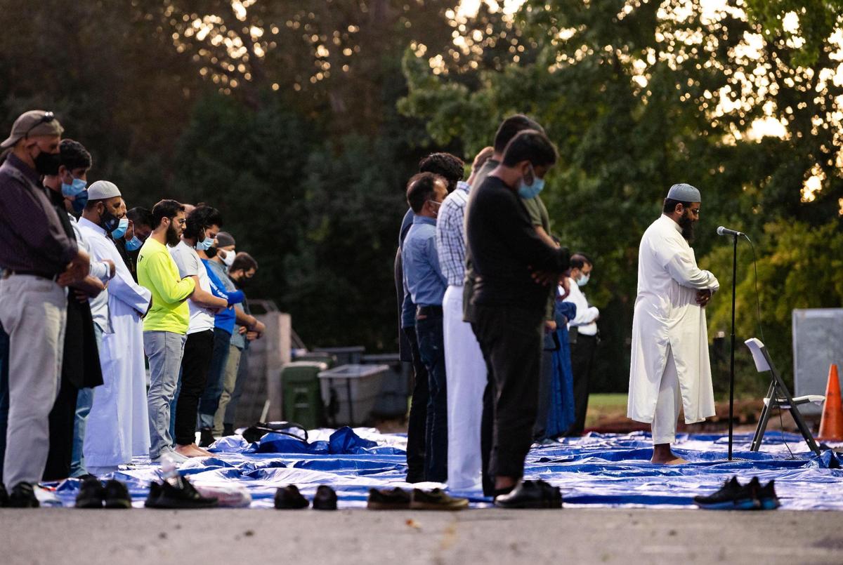 Imam Yasir Khan, right, leads prayer during a break in the event, Voices of Change: Remembering the Victims and Healing the Community, at Masjid Annur Islamic Center on Wednesday, Oct. 14, 2020, in south Sacramento.