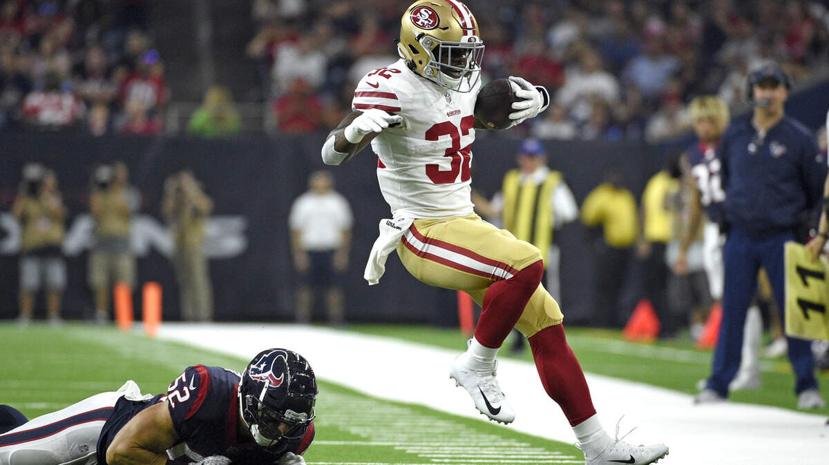 San Francisco 49ers running back Joe Williams (32) is forced out of bounds by Houston Texans linebacker Brian Peters (52) during the first half of a preseason NFL football game Saturday, Aug. 18, 2018, in Houston.