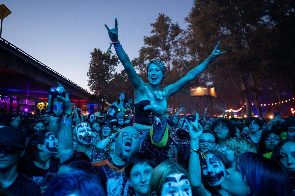Festival attendees scream as Insane Clown Posse takes the stage in the first day of the Aftershock festival on Thursday, Oct. 10, 2024 at Discovery Park.