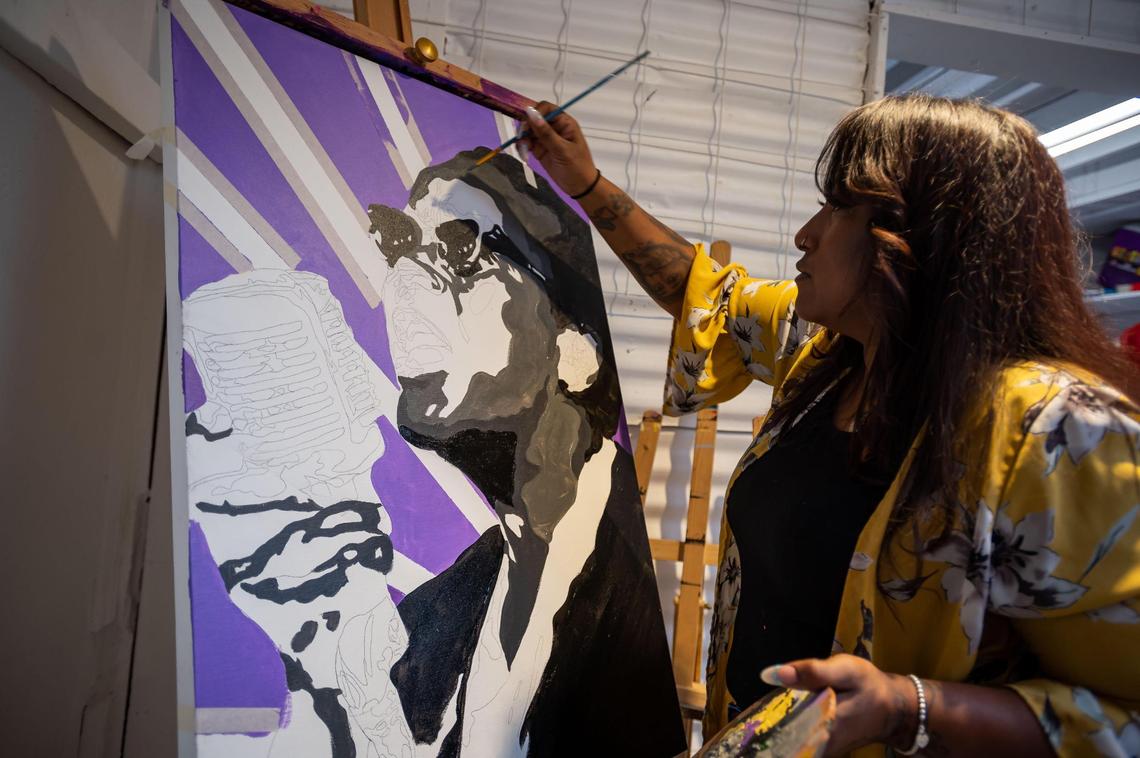 Shawntay Gorman, of TaystyArt, works on a painting of civil rights activist Ella Baker in her studio at The Brickhouse Gallery & Art Complex on Wednesday, April 6, 2022, in Sacramento’s Oak Park neighborhood.