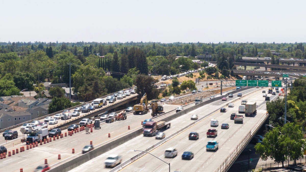 Traffic crawls on an eastbound ramp to Highway 50 in East Sacramento on Tuesday. The $529 million construction effort, now expected to wrap by July 2026, aims to add carpool lanes and resurface 7 miles of freeway.