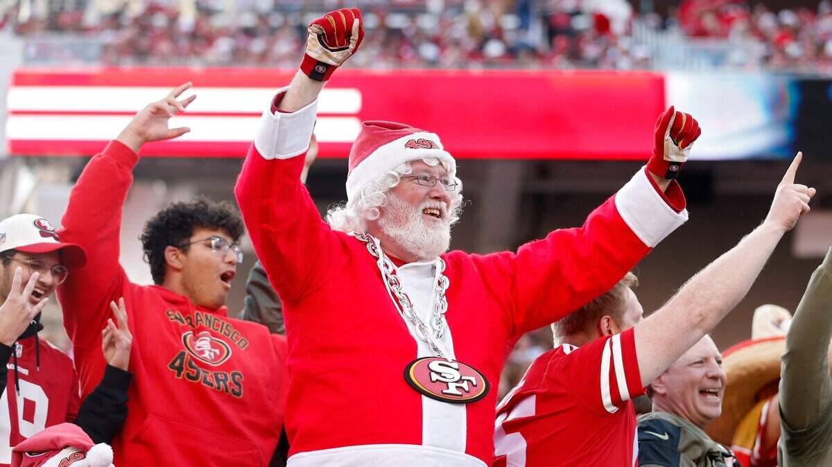 A fan dressed as Santa Claus in the stands during the second half of a game between the Washington Commanders and the San Francisco 49ers at Levi's Stadium on Dec. 24, 2022, in Santa Clara. The 49ers do not play on Christmas or Christmas Eve in 2025 but enter the holiday having clinched the playoffs and playing for the No. 1 seed in the NFC.