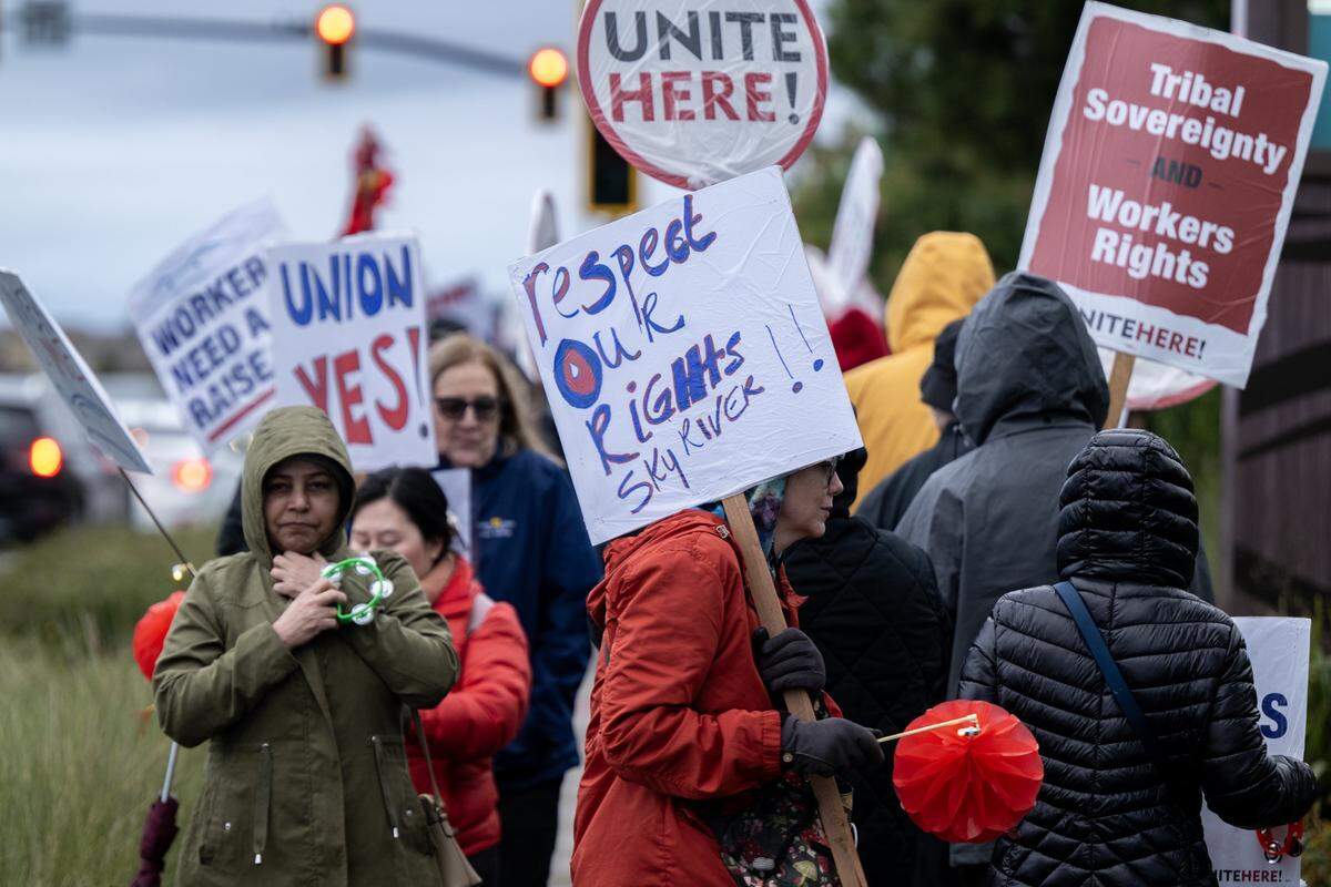 Sky River employees and supporters picket outside the casino for better wages and benefits on Tuesday in Elk Grove.