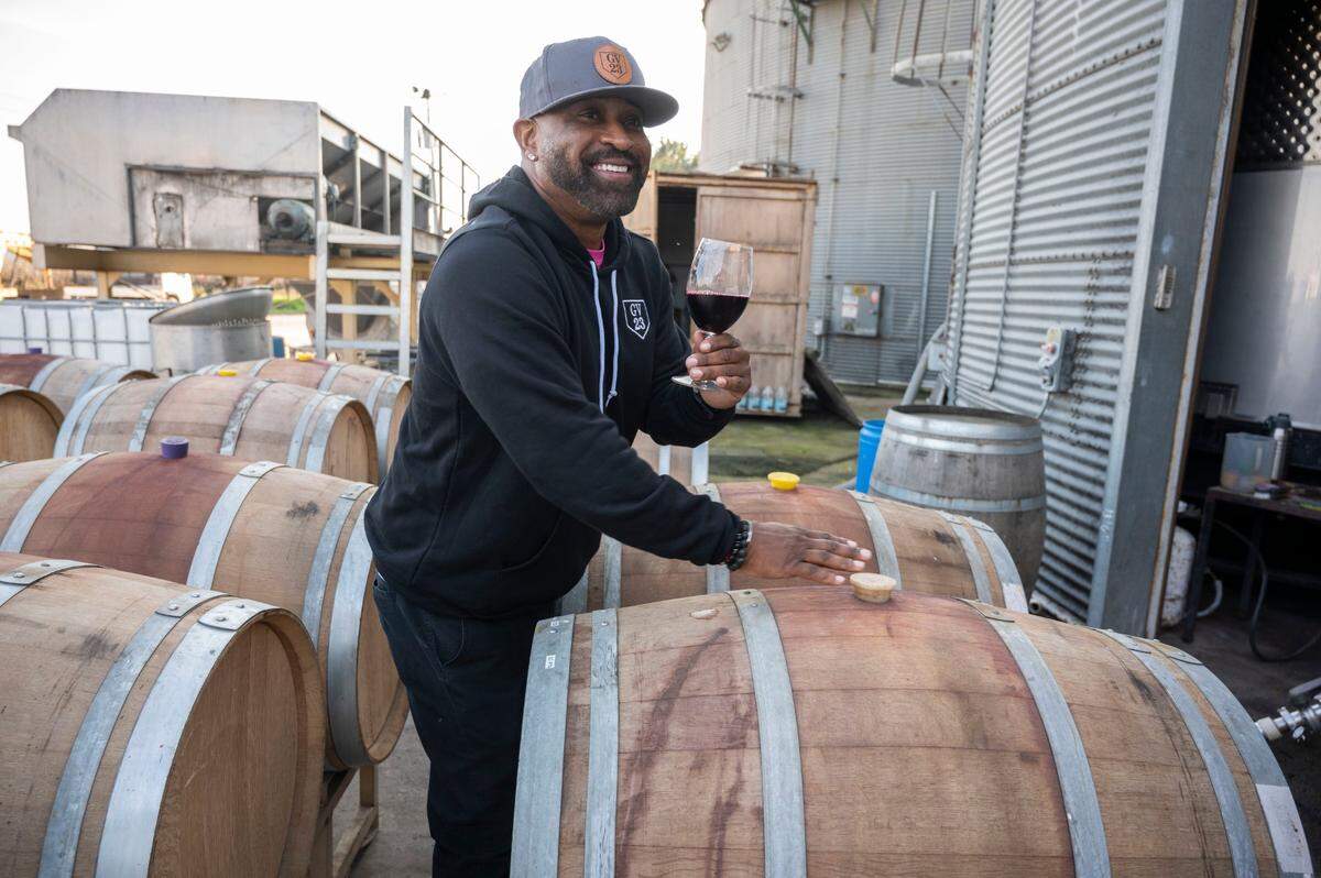 Baseball All-Star Greg Vaughn poses for a photo for his social media among wine barrels at E2 Family Winery in January. Some of the proceeds from his wines benefit his charity, Vaughn’s Valley Foundation, which aims to raise awareness and find a cure for Type 1 diabetes.