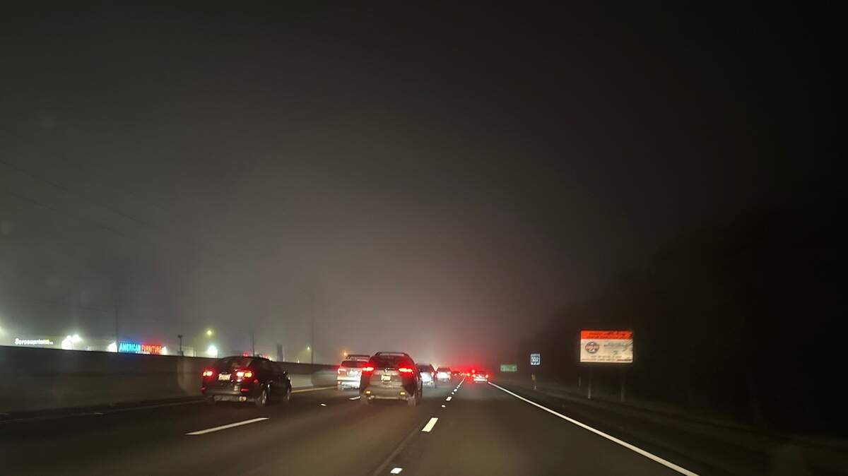 Dense fog is seen Thursday evening on southbound Capital City Freeway near Fulton Avenue in Sacramento County’s Arden Arcade area.