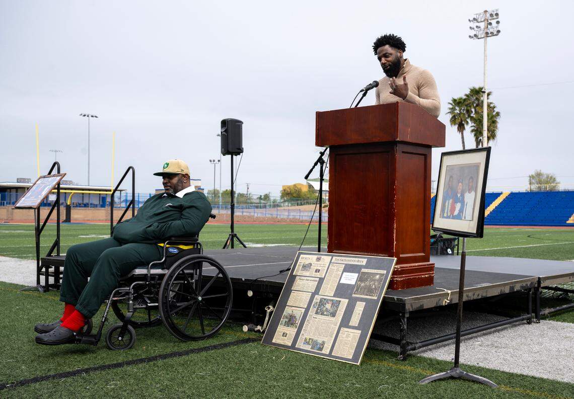 Former NFL players and Grant alumni Onterio Smith, left, and Donte Stallworth tell stories and lessons learned from their high school football coach Mike Alberghini at Grant High School on Saturday. Alberghini passed away in February.