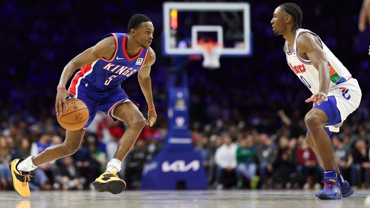 Jan 29, 2025; Philadelphia, Pennsylvania, USA; Sacramento Kings guard De'Aaron Fox (5) controls the ball in front of Philadelphia 76ers guard Tyrese Maxey (0) during the second quarter at Wells Fargo Center. Mandatory Credit: Bill Streicher-Imagn Images