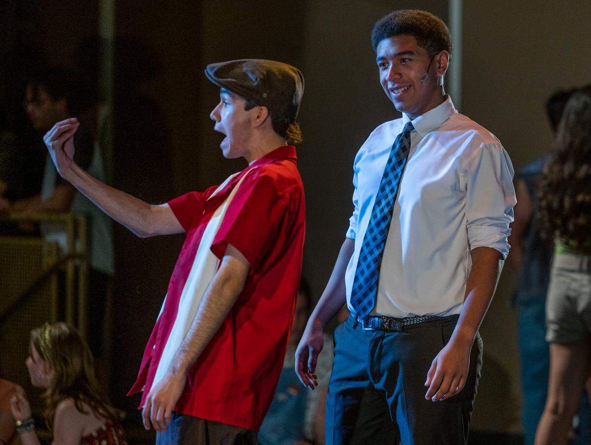 Natomas Charter School students Ali Qadiri and Matthew Smith, both 18, perform a scene from their school’s production of Lin-Manuel Miranda’s “In the Heights” on Wednesday.