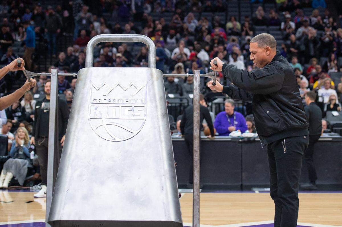 Former Sacramento Kings star Mike Bibby rings the giant cowbell before a game against the Memphis Grizzlies in January.